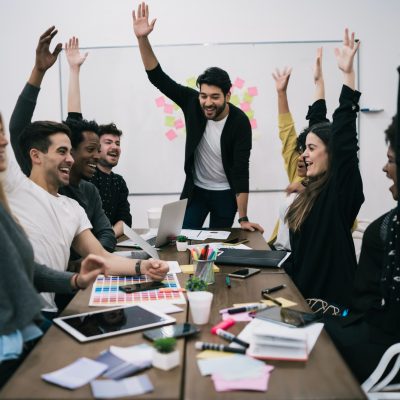 business-team-celebrating-with-raised-up-hands-
